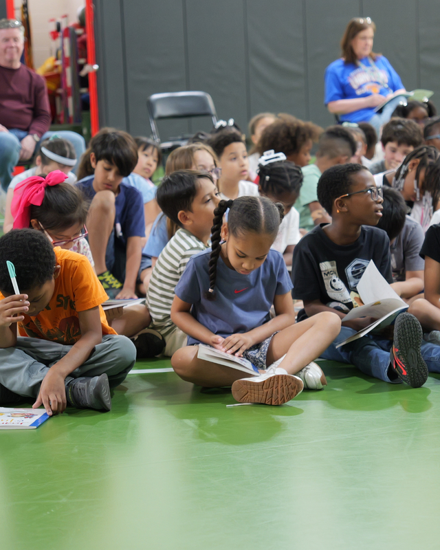 Highview students assemble in the multipurpose room and read books