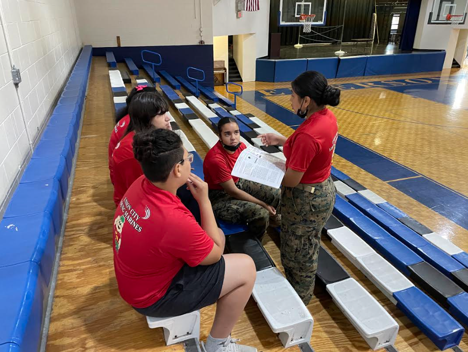 Young Marine Summer Program-Kids listening in the gym