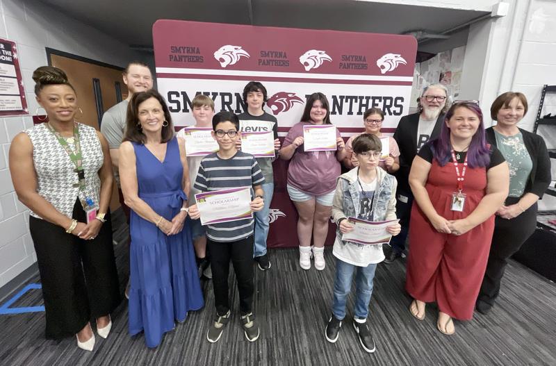 Dr. Takisha Ferguson (Principal, Smyrna Middle School), Cody Dailey (Band Instructor, SMS), Dr. Lucy Langworthy (Board Member, Rutherford Arts Alliance), Smyrna Middle School Scholarship Recipients, Jeff Lysyczyn (Executive Director, RAA), Emily Swafford (Band Instructor, SMS), Dr. Lindsay Halford (Fine Arts Coordinator, Rutherford County Schools)