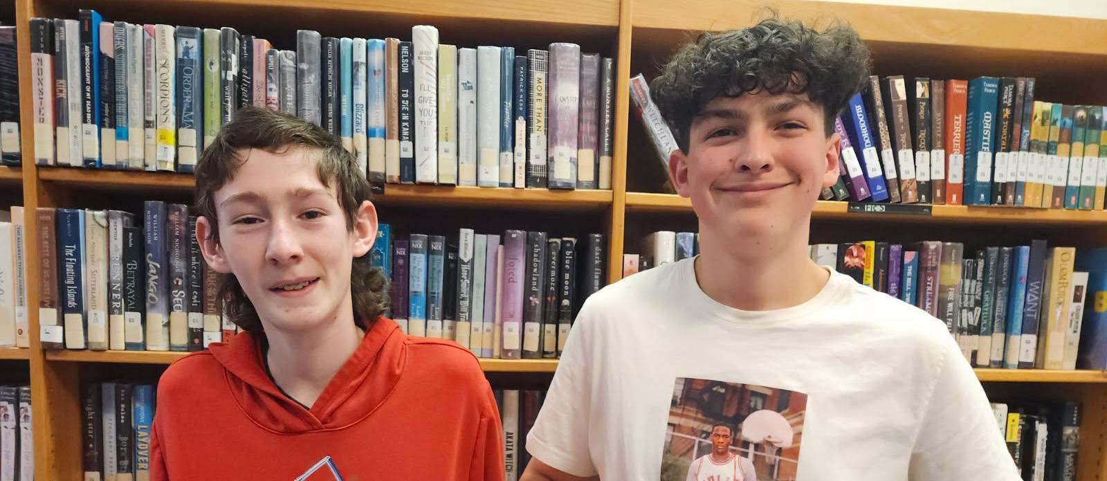 Students from advanced manufacturing displaying bumper board.