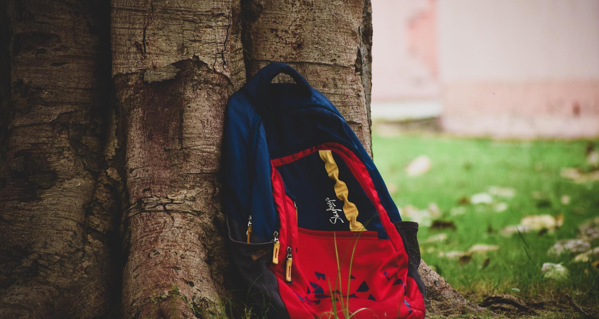 Bookbag leaning on tree