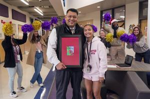 PRMS Principal Tony Trevino and Overall Christmas Card winner Jenny Le