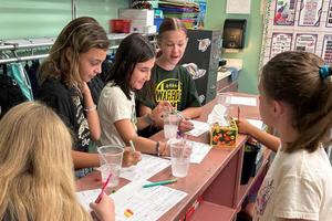 Sunrise Elementary students Aria Matthews, Avery Fitzroy, Emillee Artman and Reagan Ornelas experiment in the candy lab
