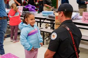 westwind student smiling with lubbock firefighter