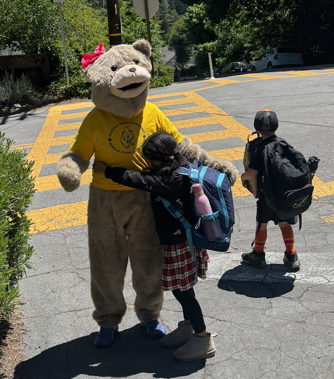 Image:  BCE Bear being hugged by a child