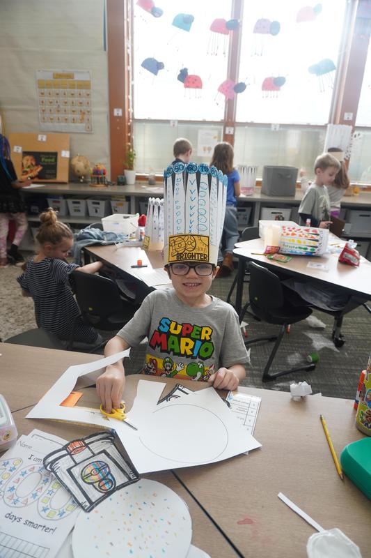 A student wears his 100 day crown.