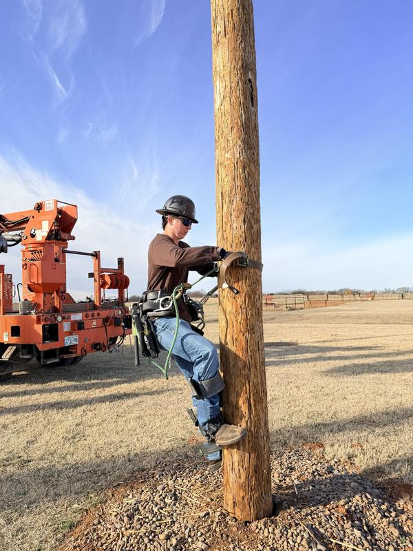 lineworker students climbing a pole