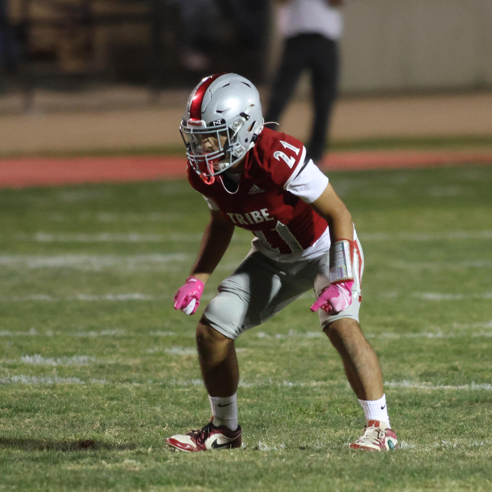 Varsity football players in action against Parlier 147