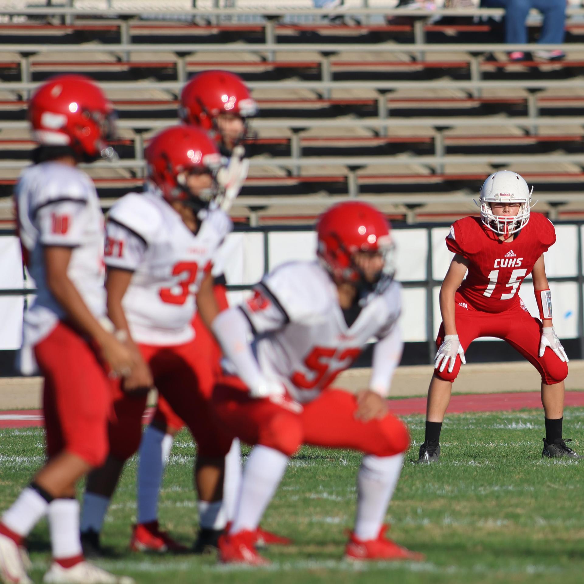 junior varsity football players in action against Fowler