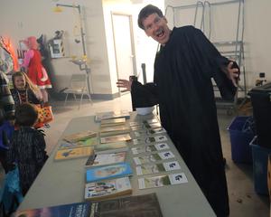 Librarian Wally Keniston giving away the last few free books for kids