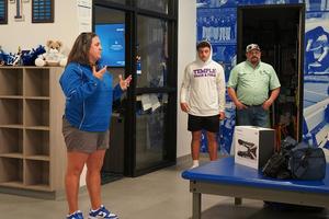 Skrabanek's family looks on as she speaks