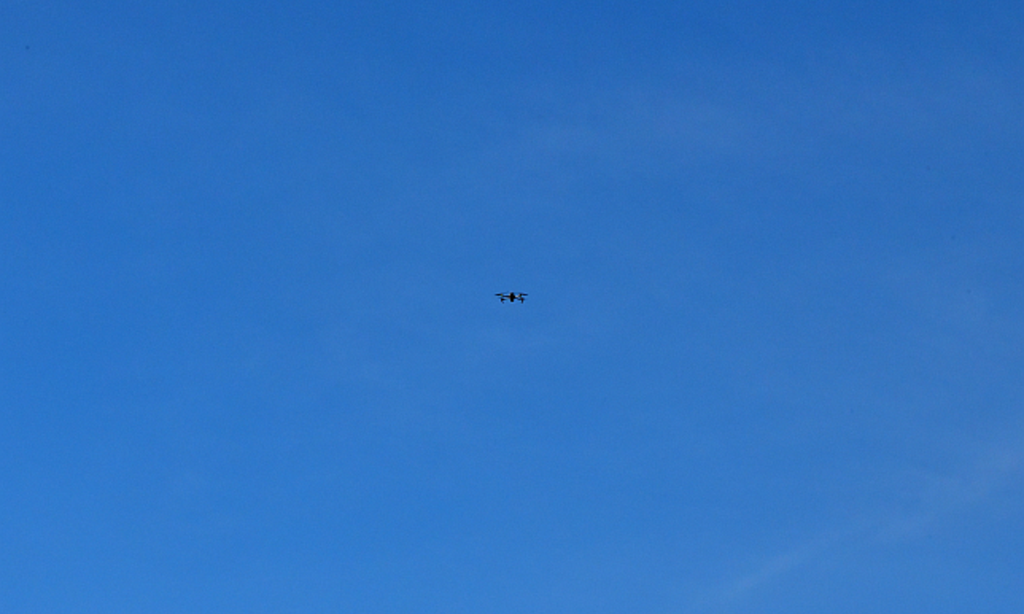 Drone in a bright blue sky