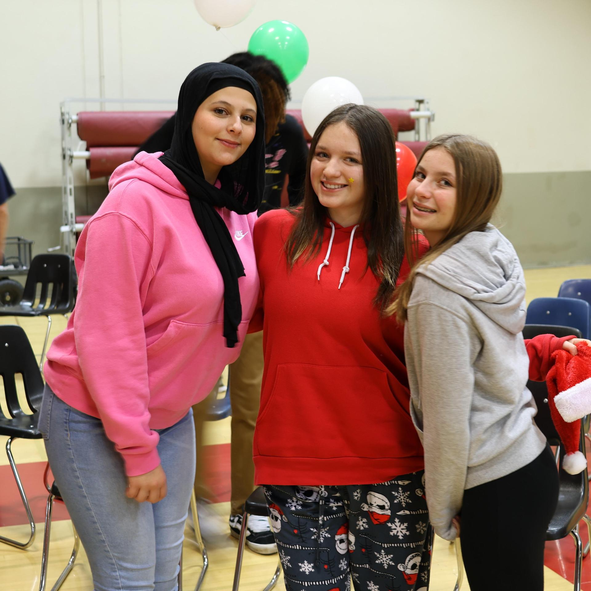 students and staff posing at the winter wishes rally