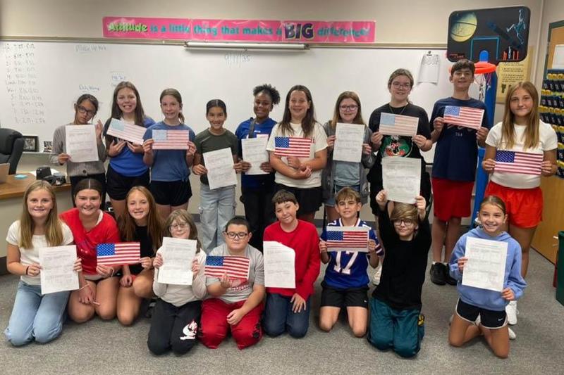 Trafford Middle School students show their calculations and their flags
