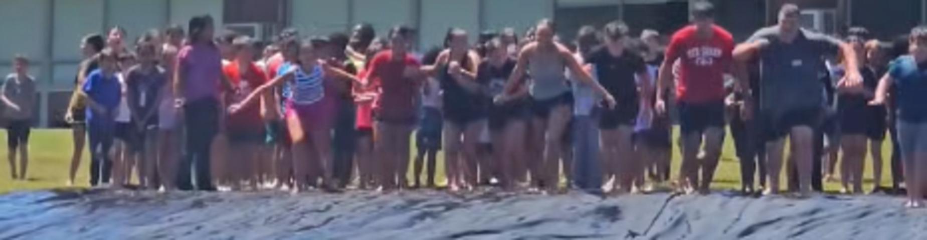 MHS and MES students getting ready to slip and slide during field day!