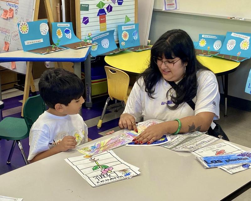 Parent and child admire student school work