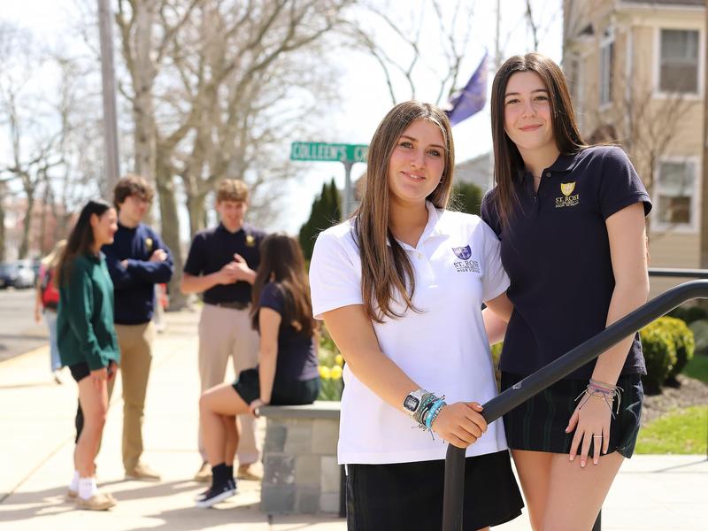 student on front stairs