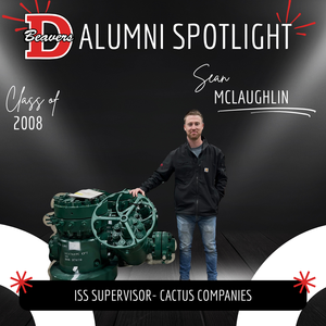 Sean McLaughlin Alumni Spotlight - Standing beside gas equipment