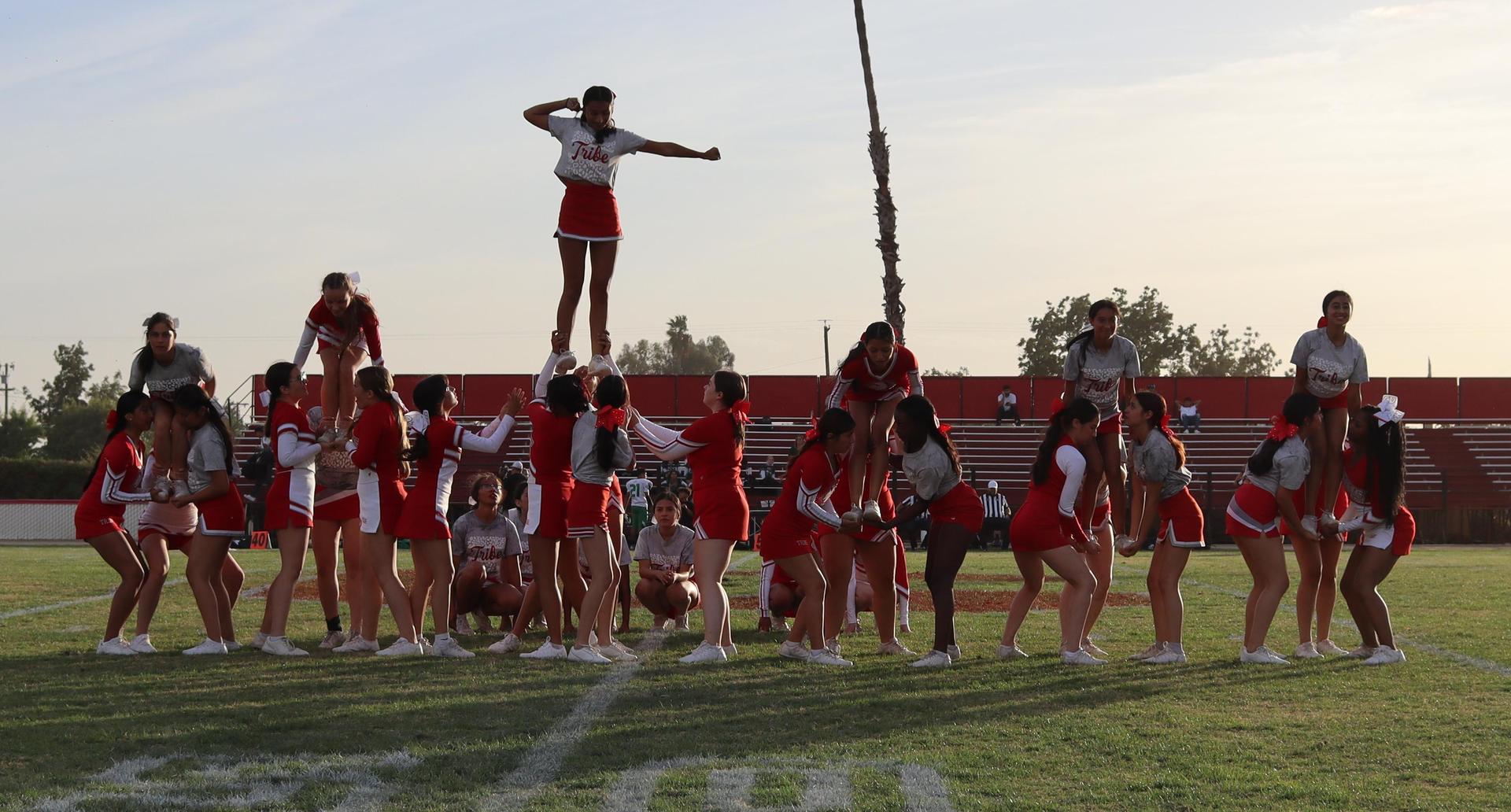 Combined cheer performing at halftime of the football game