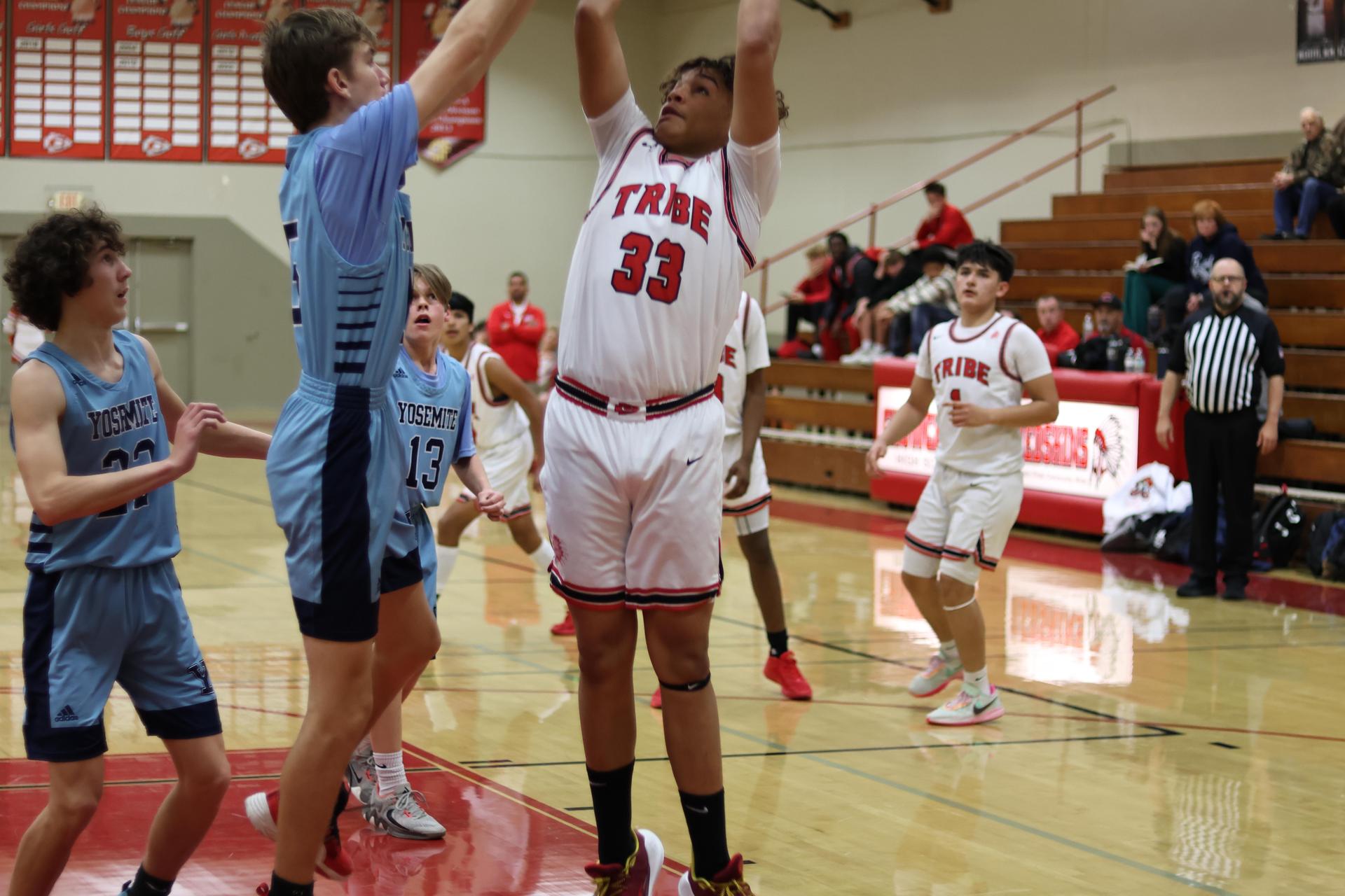 junior varsity boys playing basketball against yosemite