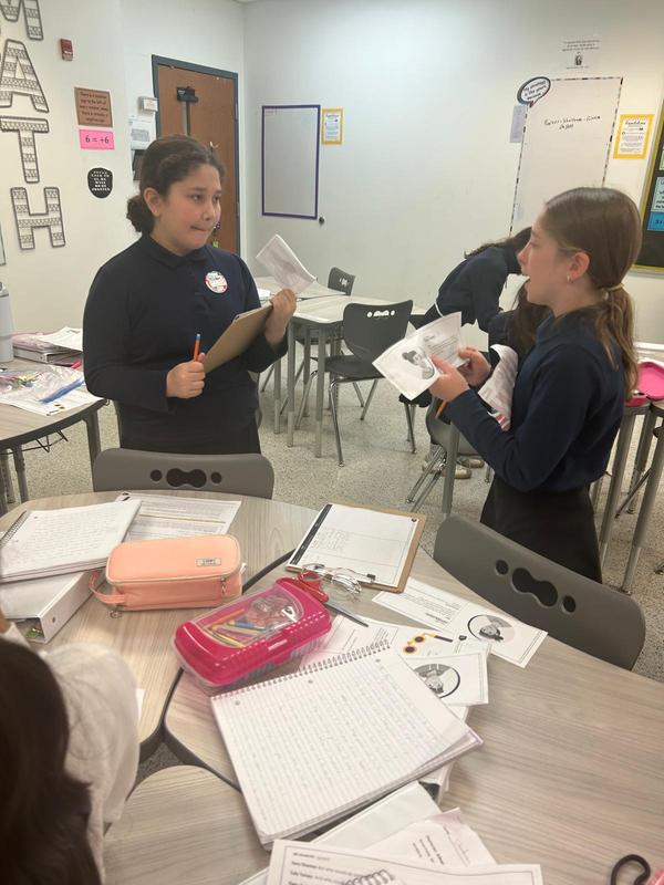 Two girls working at the Reading Mystery Theater