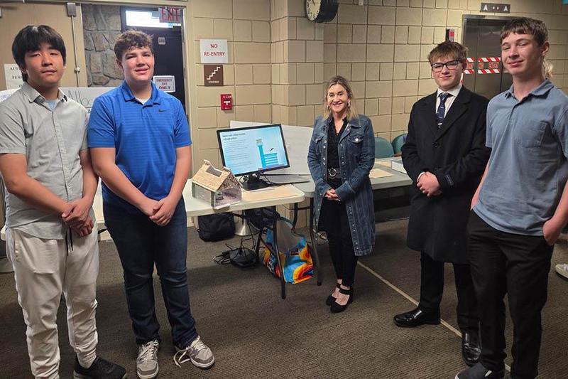 9th-graders Nicholas Phan, Nolan Yeager, Liam McCabe, and Colton Ward with Senator Kim Ward (center)