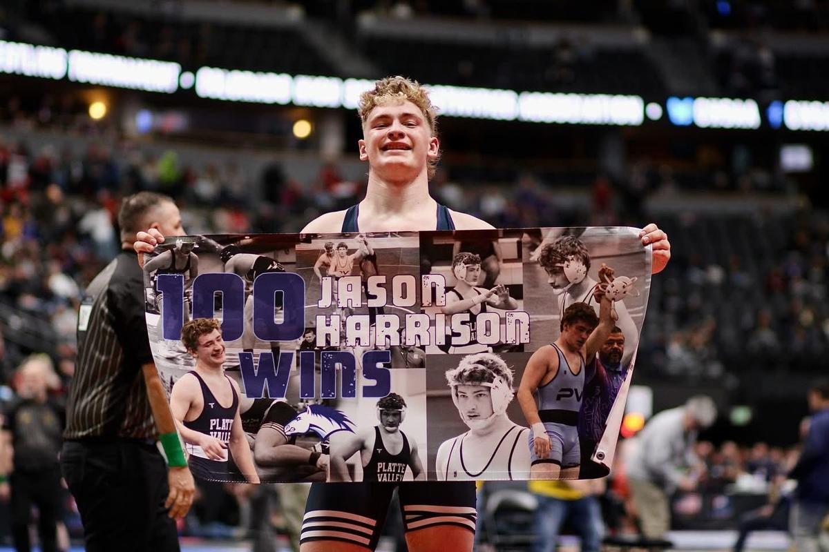 Student gets 100 wins at wrestling competition