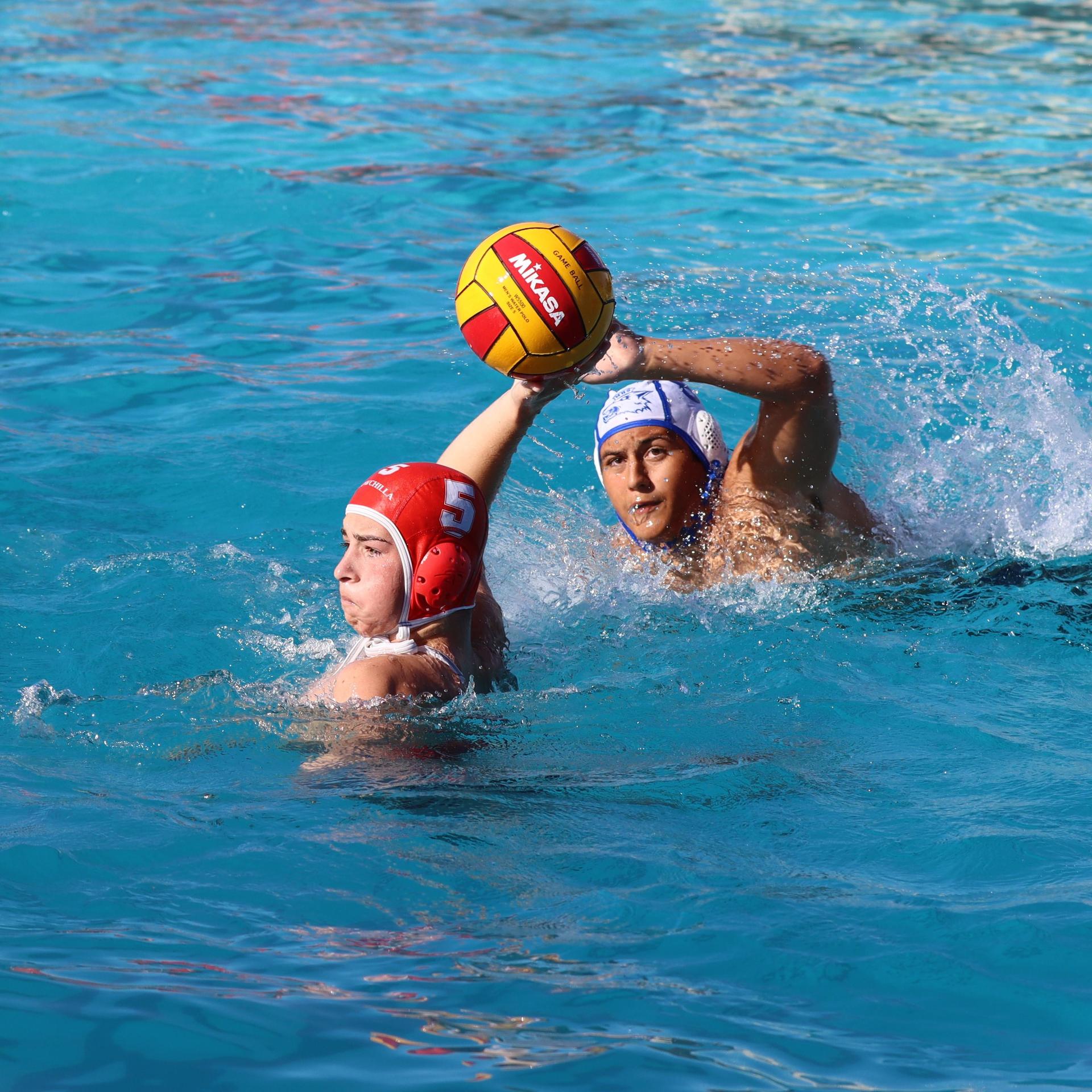 boys playing water polo against Madera