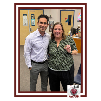 A man and woman posing for the camera