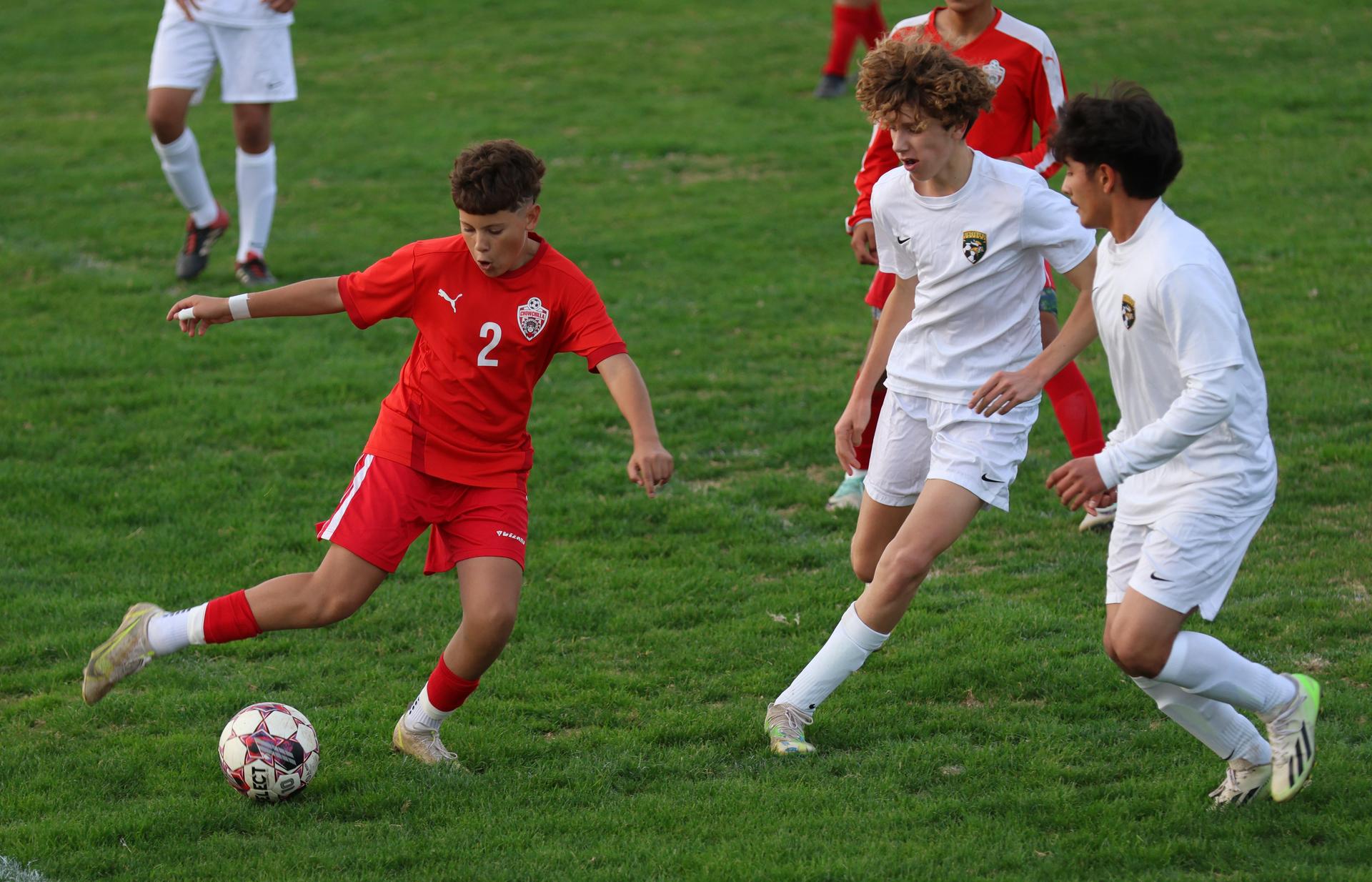 Junior Varisty boys playing soccer against Kingsburg