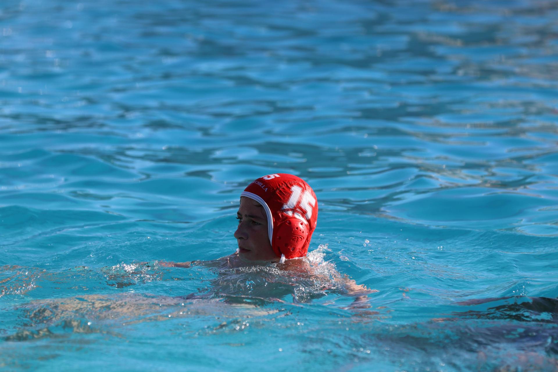 boys playing water polo against Madera