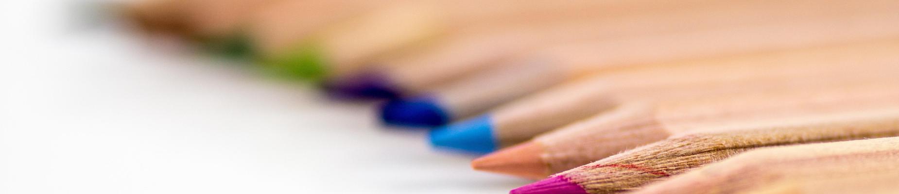 This is a picture of brown pencils aligned on a table. The point of each pencil is a different color. Each pencil can write in a different color in your book. Make sure that whatever is written is a good thing.