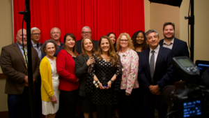 Superintendent Mays Kakish with an award among her colleagues.