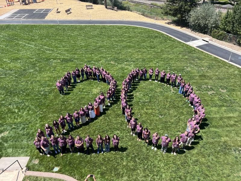 School staff in the shape of a 20