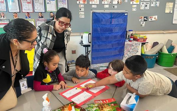 superintendent, teacher, and students