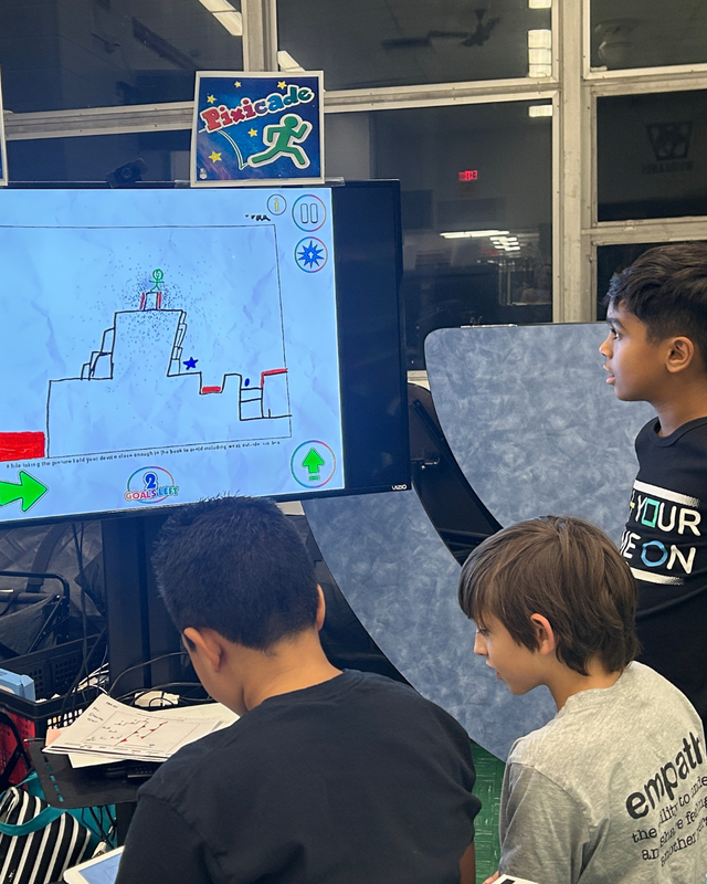 RJB students at laptops working on coding