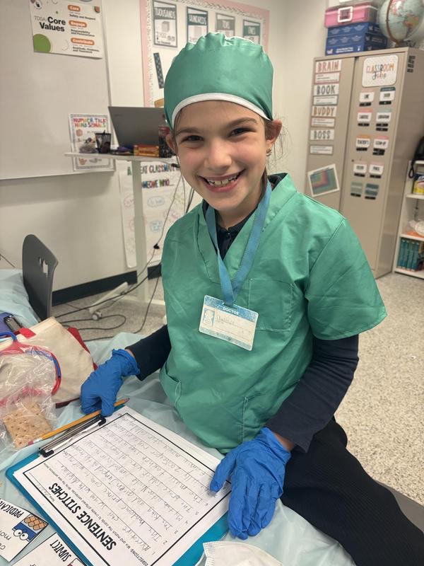 A second grade girl performing surgery on sentences!