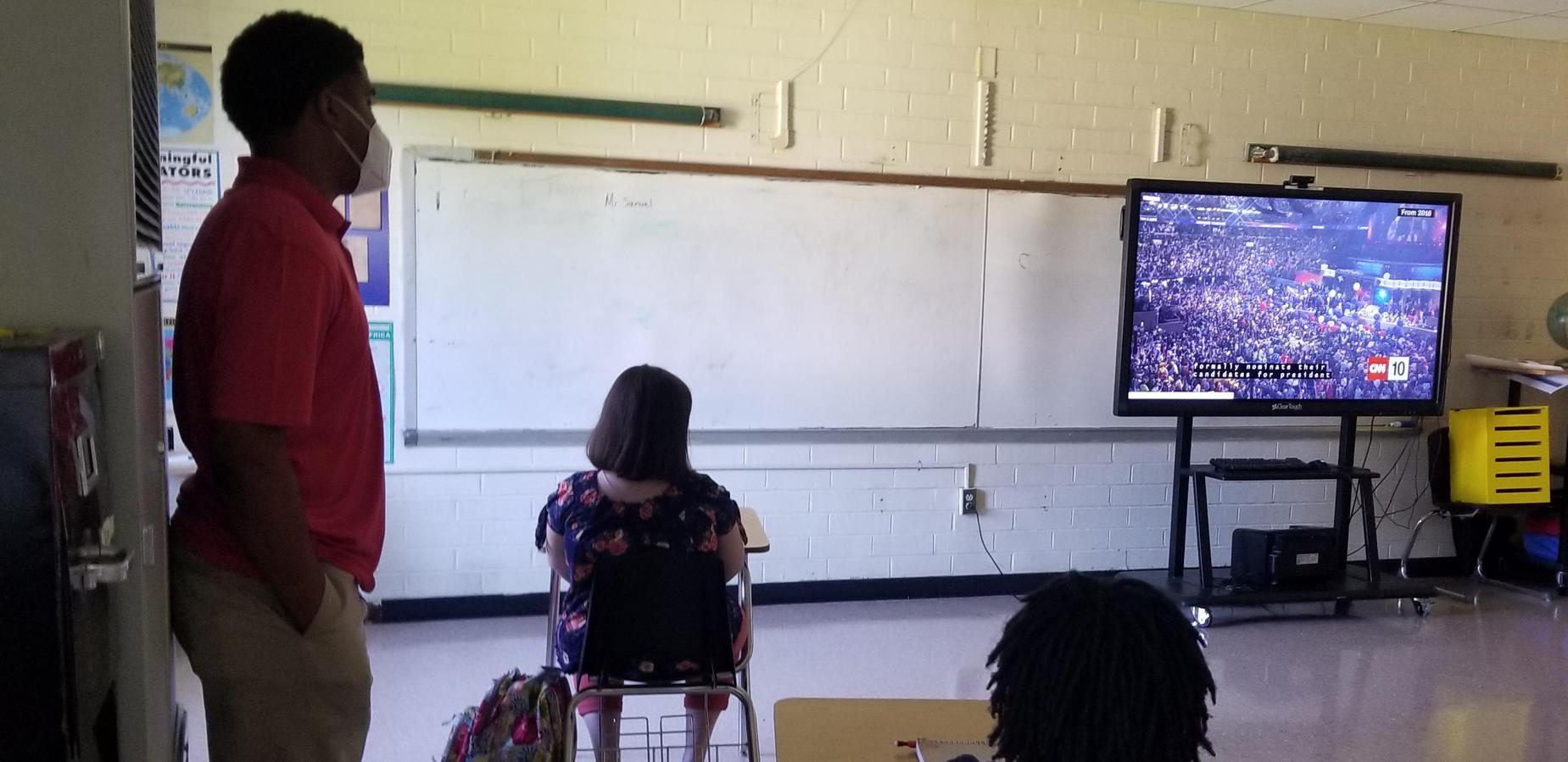 Ms. Samuel teaching virtually and face to face
