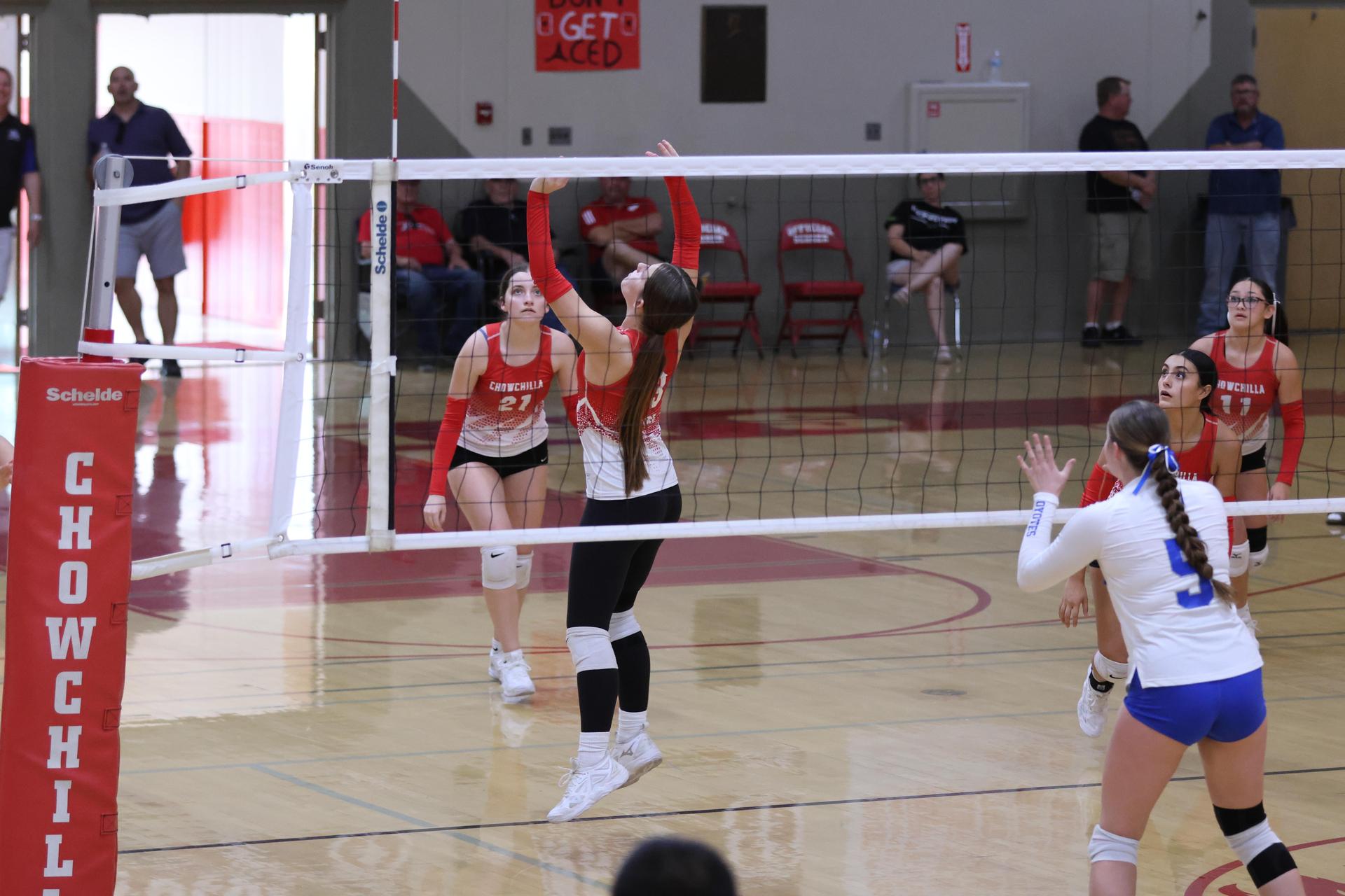 Varsity girls Volleyball playing vs. Madera 56