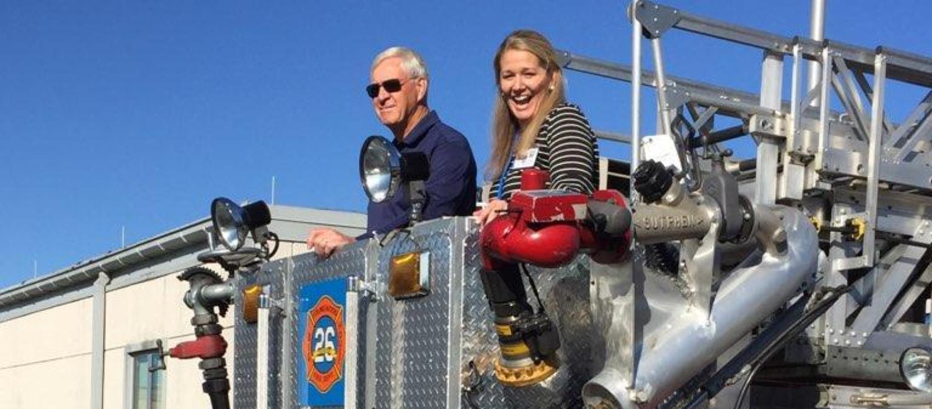 Principal in firetruck bucket