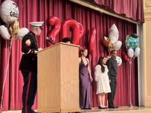 a military person trying to recruit new graduates