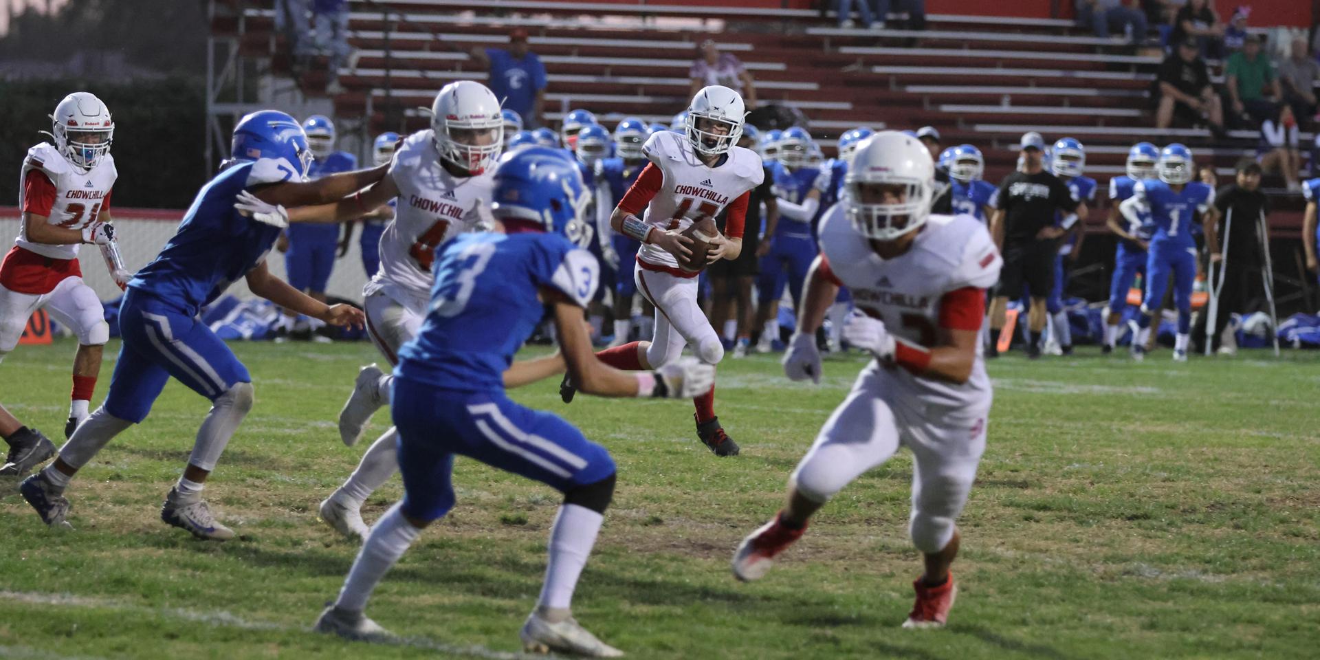 Junior Varsity football players in action against Caruthers