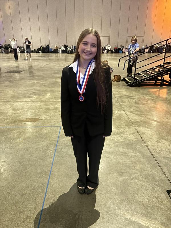 Smiling teens dressed in professional attire