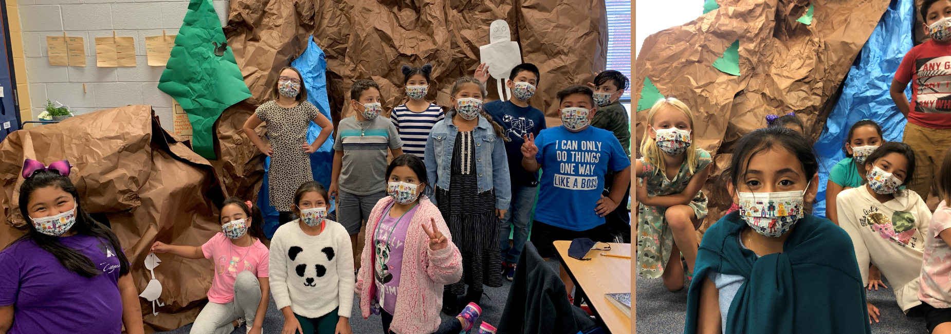 group of students in front of a paper mountain they created
