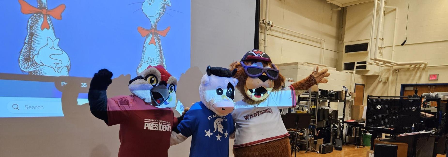 Three mascots on stage