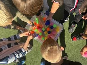Students throw water balloons at principals.
