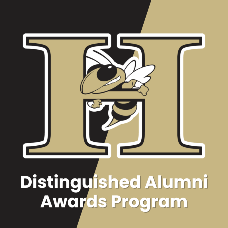 A square logo featuring a stylized, large, gold and black "H" with a thick white outline. A cartoon-style hornet, also in gold and black with a friendly expression, is flying out from behind the right vertical bar of the "H". The background is split diagonally, with the top left half being black and the bottom right half being gold. White text below the logo reads "Distinguished Alumni Awards Program".