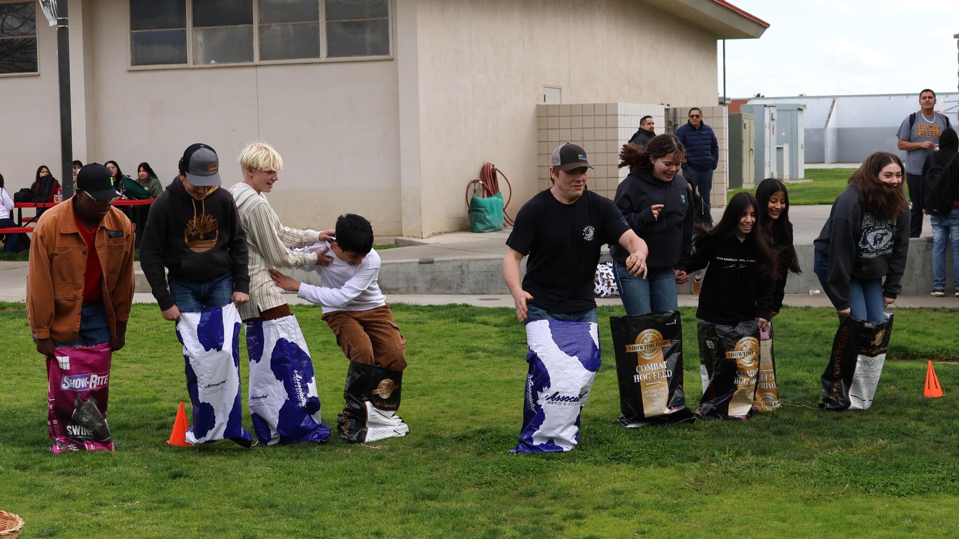 students and staff enjoying the feed bag relay