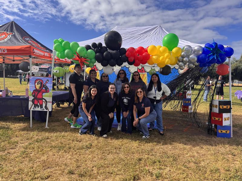 Staff in front of booth