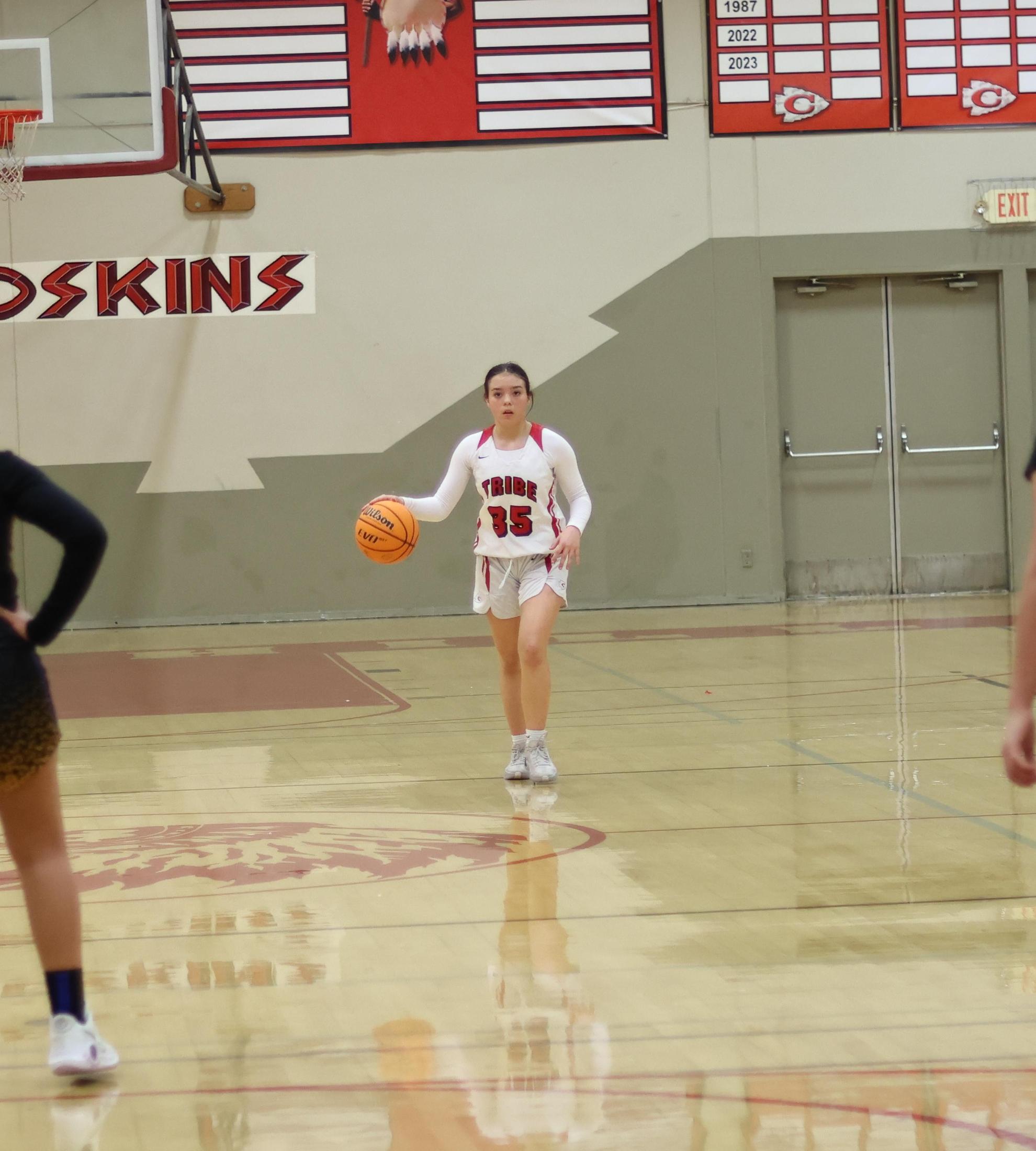 junior varsity girls playing basketball against parlier
